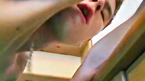 Close-up of young caucasian man's ecstatic face, open mouth in gay pleasure