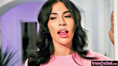 Sultry Latina shemale in pink top teases with tongue out