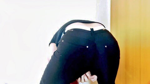 Slim woman bending over in tight black jeans, exposing ass in solo masturbation scene