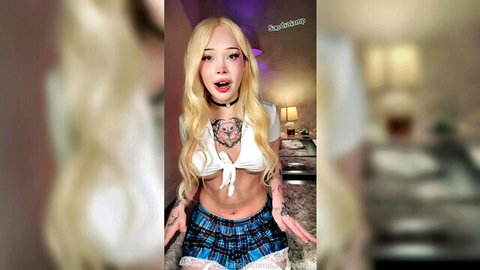 Sandra Lamp in sexy schoolgirl outfit with ball gag and wolf tattoo tease