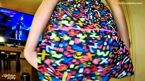 Babe lifts colorful patterned skirt upskirt revealing bare big ass cheeks from behind