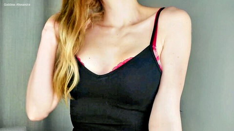 Blonde babe teasing with huge tits spilling from black lace bra cleavage