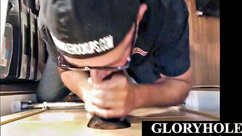 Eager cub sucking big black cock through gloryhole wall