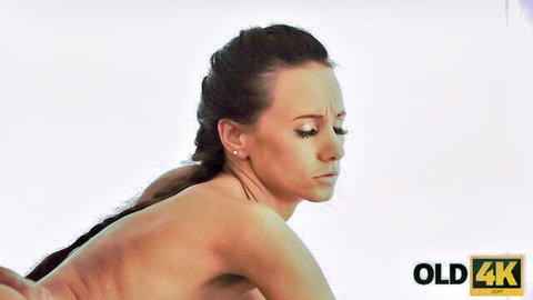 Nude brunette with braid arches back showing side tits and bare ass seductively