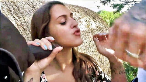Brunette grips thick BBC to puckered lips outdoors by hay bales ready for deepthroat