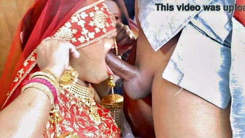 Indian bride in red saree and gold jewelry sucks thick black cock deeply
