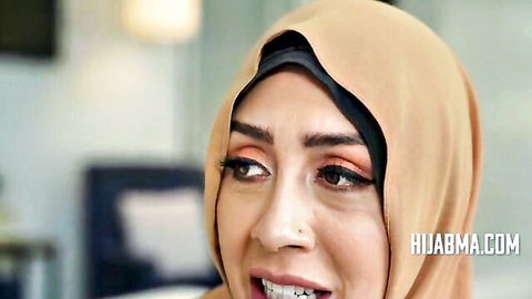 Lilly Hall as divorced Muslim lady in hijab, smiling seductively in adult scene