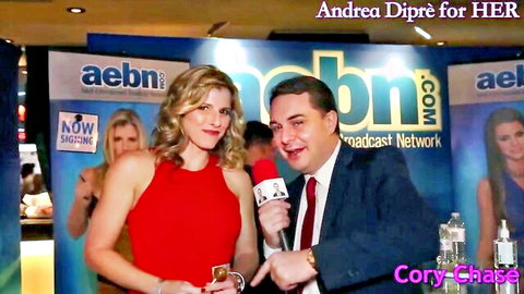Cory Chase in red dress interviewed by Andrea Diprè at adult event