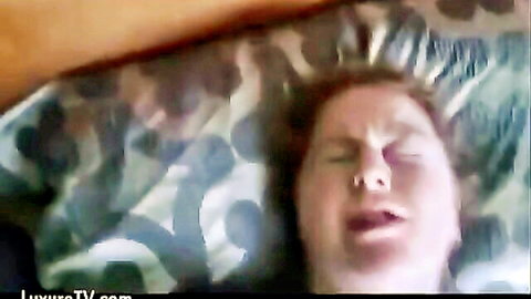 Redhead man mouth wide open gasping in humiliation on polka-dot pillow bed POV