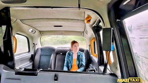 Kiara Love in Fake Taxi, sexy redhead passenger in denim jacket and orange top