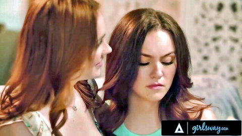 Redhead and brunette lesbians gaze intensely before hot kiss in teasing closeup
