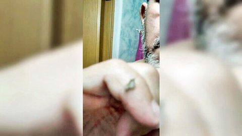 Bearded gay man shows off ring on finger close-up solo tease