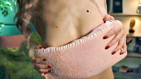 Lolly Bella slim nude side view holding pink towel over breasts in cam show