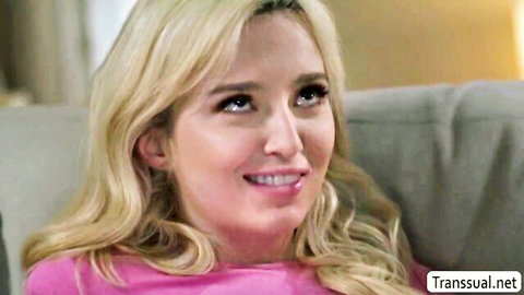 Lexi Lore blonde babe smiling in pink top from shemale scene