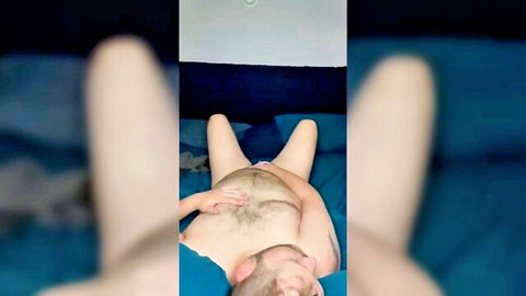 Amateur naked white guy on bed, hand on hairy crotch, first video part two