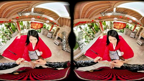 Suki Sin in red cheongsam kneeling in immersive VR porn setup