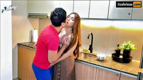 Pinay woman with exposed breasts kissed passionately from behind in kitchen