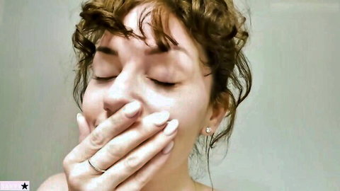 Curly redhead stepmom covering mouth in seductive surprise, hotel taboo thumbnail