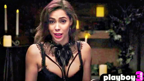 Stunning brunette in black lace lingerie with big breasts and shocked expression