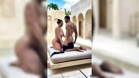Muscular ebony man grips nude big booty woman's hips for outdoor doggy style fuck