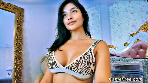 Latina beauty in zebra striped lingerie stripteasing and rubbing pussy