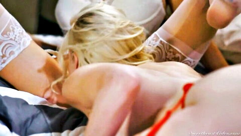 Blonde in white lace lingerie spreads legs wide exposing shaved pussy during intense missionary fuck