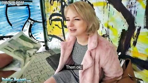 Short-haired blonde amateur teen in pink fur jacket at bus stop pickup