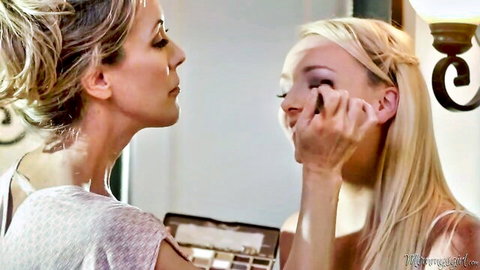 Brandi Love applies makeup to Carmen Callaway in intimate blonde lesbian scene