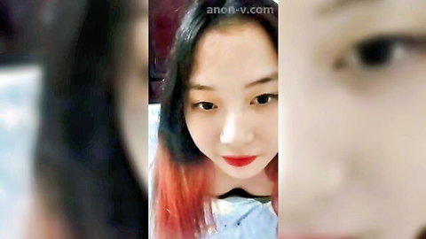 Florence MeowMeow Asian beauty with red-tipped hair and red lips close-up