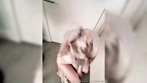 Blonde babe nude on all fours exposing bare ass from behind on carpet