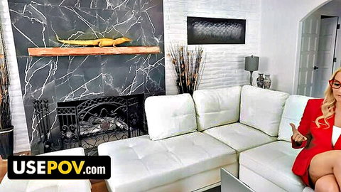 Blonde MILF Julia Robbie in red blazer teasing on couch POV