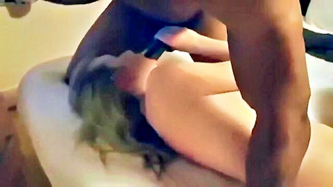 Blonde amateur grips massive BBC near her open mouth in bubble bath for interracial blowjob