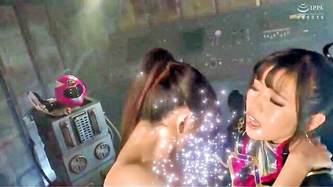 Two Asian women in sci-fi outfits passionately kissing with sparkles