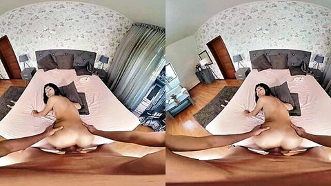 Asian woman naked on bed, legs spread wide for black man's penetration from behind