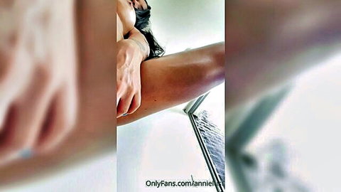 Annie Lust solo tease, nude slim Asian woman extending arm seductively