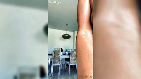 Side view of nude woman posing topless in elegant room, Mov-108