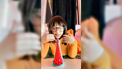 Asian babe Anaaa in glasses teases with pink tentacle dildo