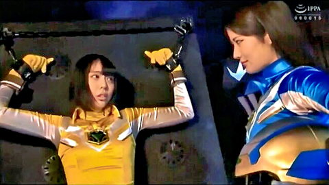 Asian women in tight yellow and blue Power Rangers cosplay suits, chained arms up, seductive pose