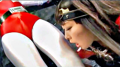 Asian woman in crown performs oral on red latex suited partner