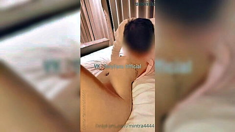 Asian amateur babe lying naked on bed spreading her shaved pussy with fingers