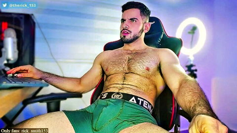 Hairy muscled gay stud teases huge bulge in tight green underwear on webcam