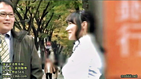 Kaho Shibuya smiles with suited man in outdoor JAV pickup scene