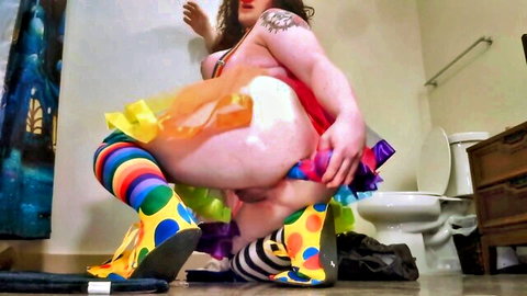 Tattooed BBW clown babe squats exposing huge pale ass with white cumshot in bathroom