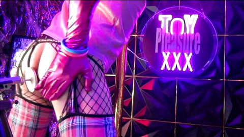 Sissy in pink latex gloves and plaid skirt gets anal toy fucked in fishnets