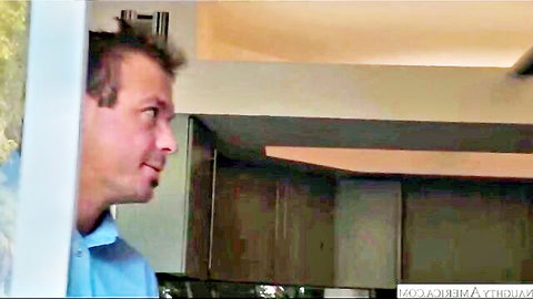Side profile of man in blue shirt gazing intently in big tits redhead hard fuck scene