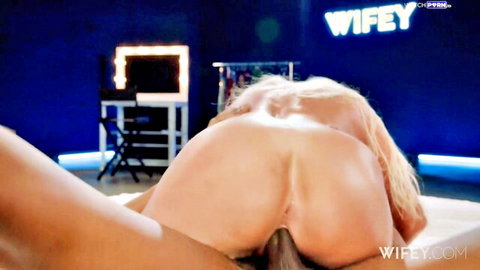 Blonde babe bends over in doggy style exposing huge ass pussy and asshole on Wifey TV set