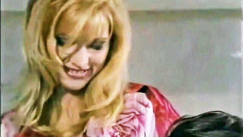 Charming blonde MILF smiling seductively in pink rose dress, arousing adult clip