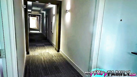 Busty MILF in hotel hallway teases stepson in taboo family scene