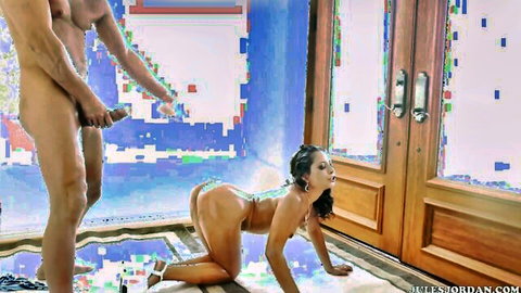 Petite brunette with big ass in doggy pose as nude stud strokes thick cock behind her exposed pussy