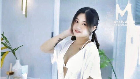 Young Chinese stepmom in white bikini and open robe, smiling sensually